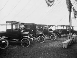 Automobiles on Display in Showroom Interior - Art Print