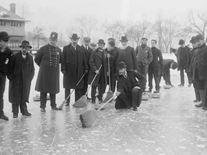 Curling in Central Park with Men having Brooms at the ready over the ice. - Art Print