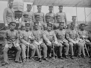 Graduating Class of Japanese Aviators in Uniform with Ceremonial Swords seated in front of Airplane - Art Print