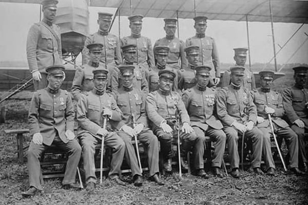 Graduating Class of Japanese Aviators in Uniform with Ceremonial Swords seated in front of Airplane - Art Print