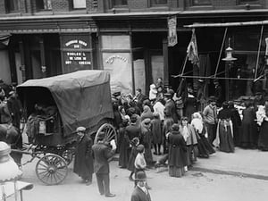Crowd gathered in front of butcher shop during meat riot