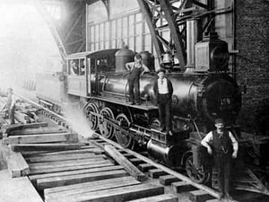 Three Men Standing On Train