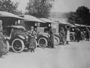 A line of Women Ambulance Drivers with their vehicles - Art Print