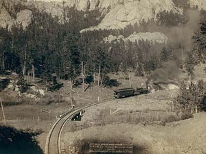 Horse Shoe Curve.' On Burlington and Missouri River Railway. Buckhorn Mountains in background by John C.H. Grabill - Art Print