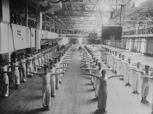 Naval Cadets exercise in large hangar in their calisthenics - Art Print