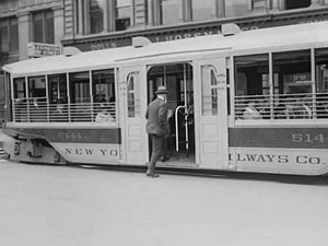 New Yorker appreciates the new Trolleys which are so low to the street that it takes but one step to access. - Art Print