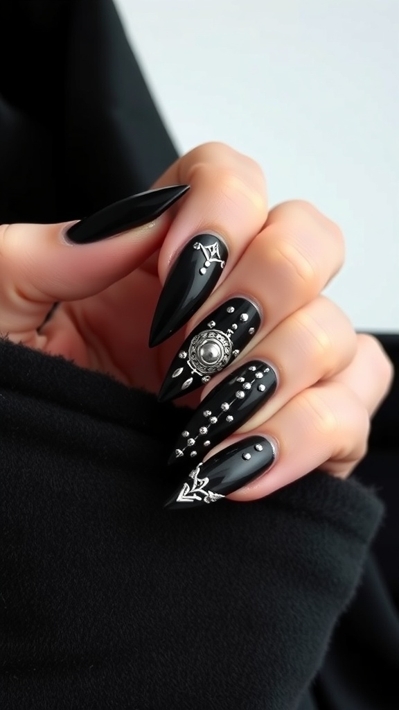 Gothic black acrylic nails with silver accents and designs