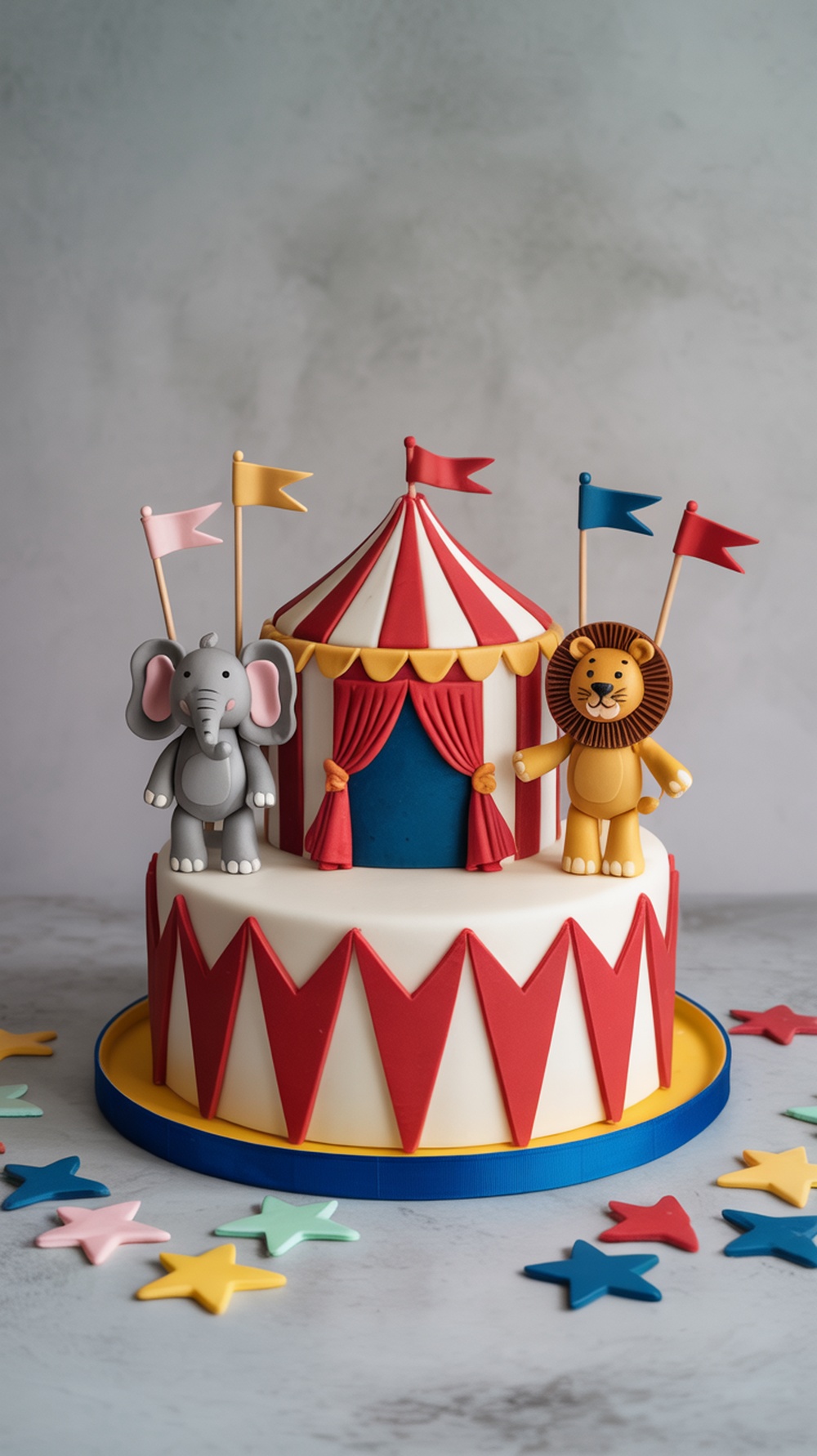 A colorful circus-themed baby shower cake featuring an elephant and a lion on top of a striped tent.
