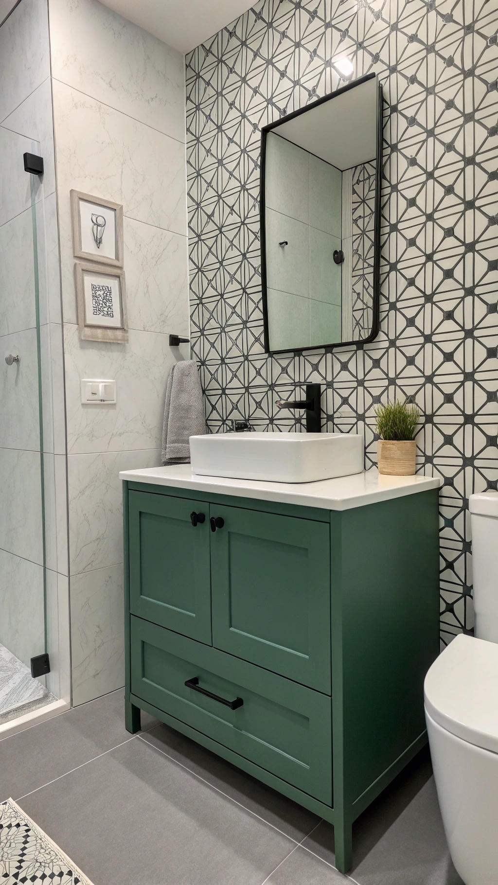 A modern bathroom featuring a green cabinet and monochrome wallpaper.