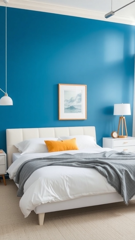 A modern bedroom with a blue accent wall, white bedding, and stylish decor.
