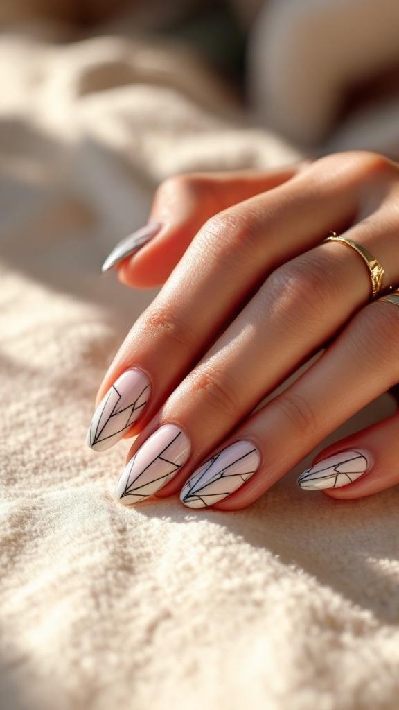 Close-up of hands with geometric chrome patterned nails on a soft background.