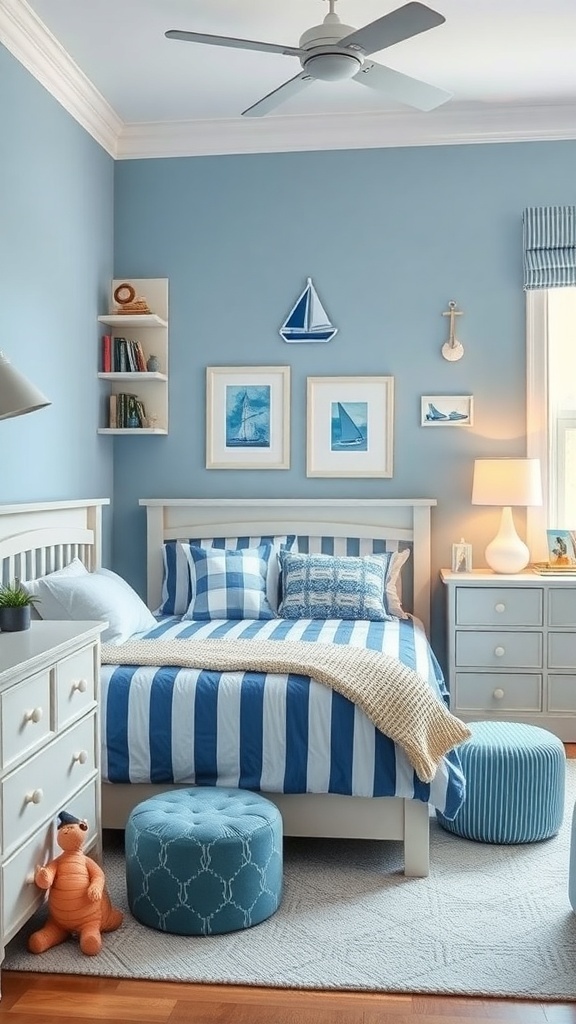 A boy's bedroom with a nautical theme featuring blue walls, striped bedding, and sailboat decor.