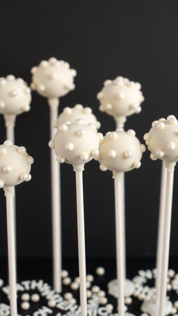White cake pops decorated with pearl candies