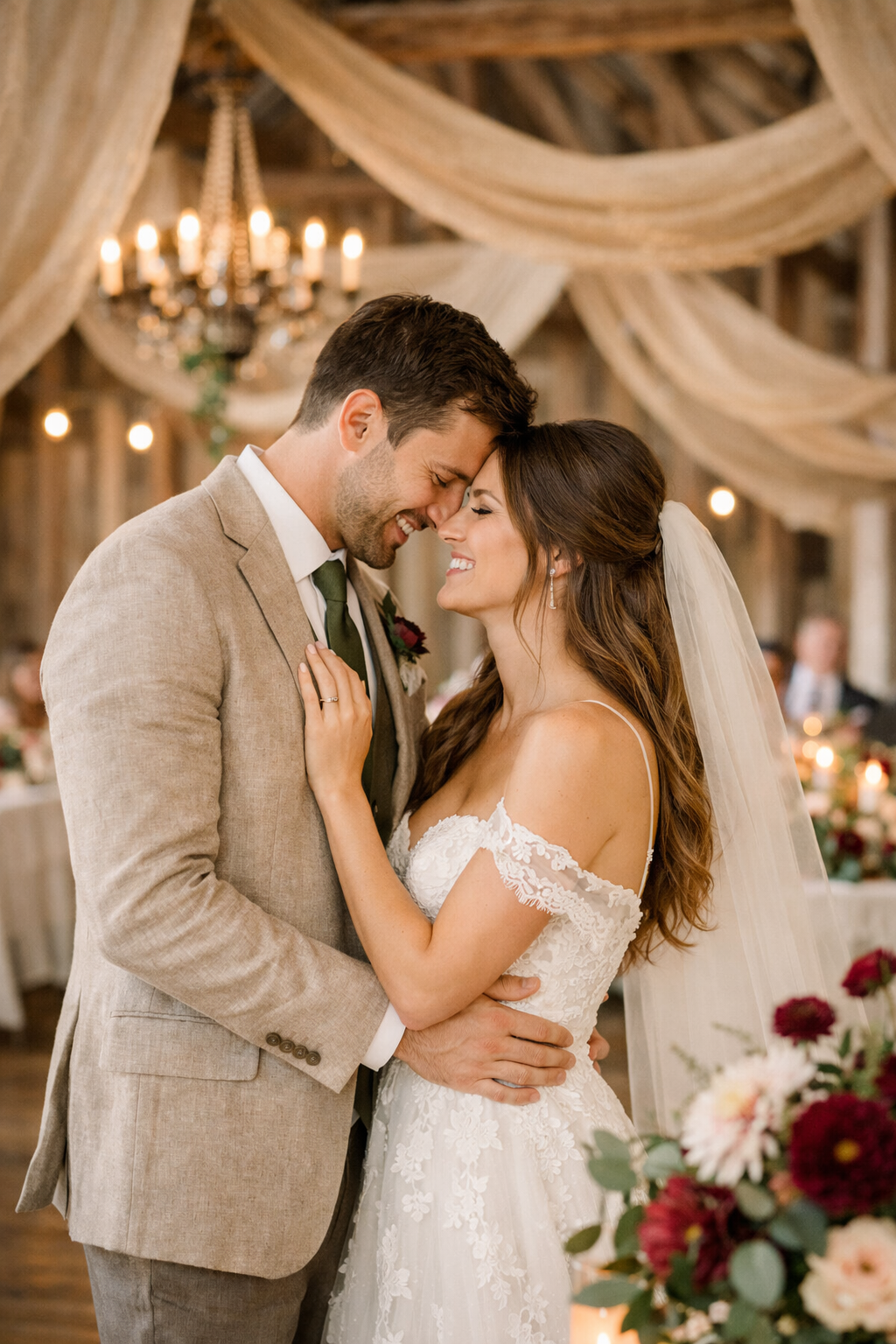 A couple embracing in a rustic wedding setting, showcasing burgundy and olive green decor.