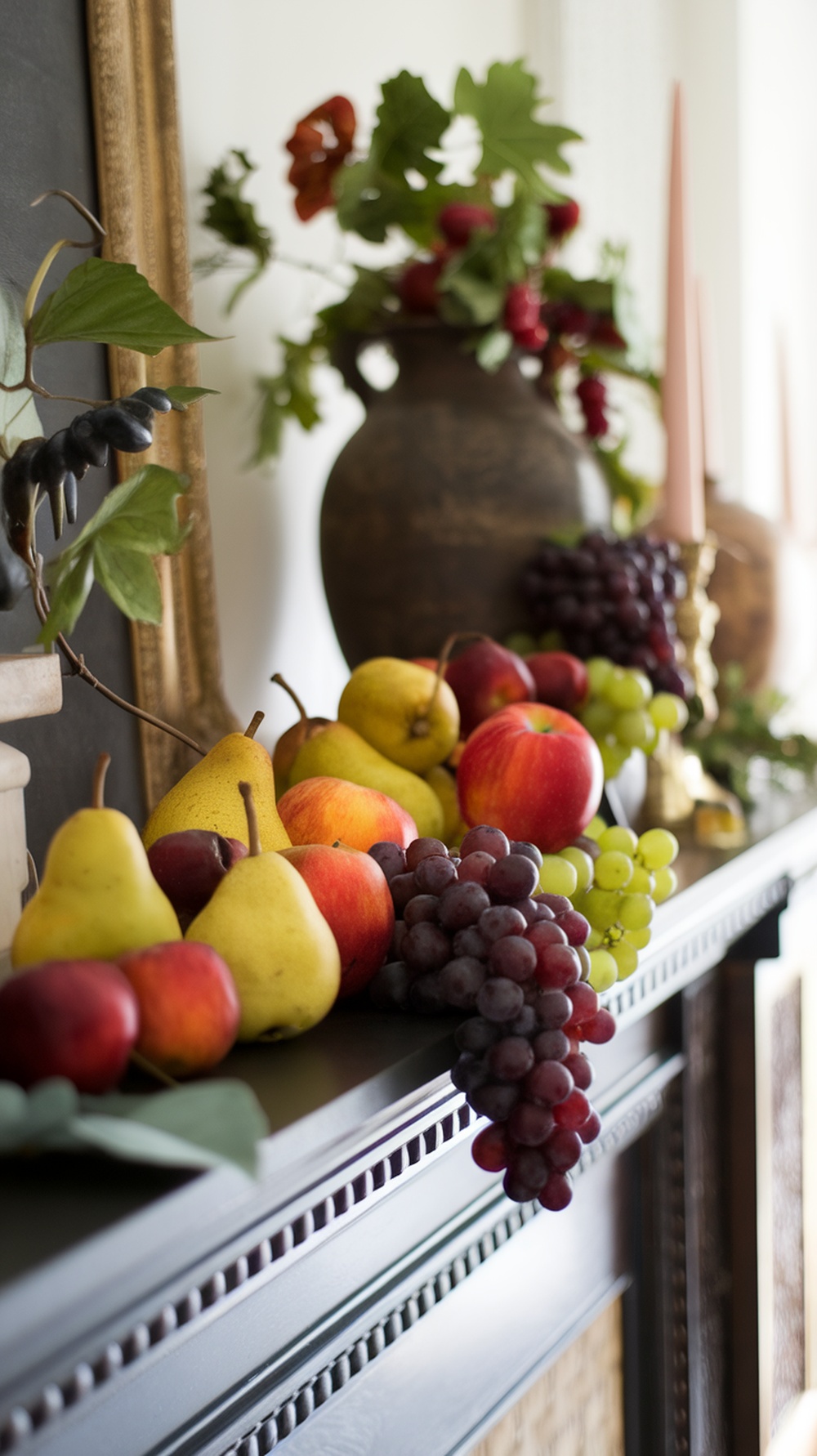 A beautifully arranged display of seasonal fruits including apples, pears, and grapes on a mantel.