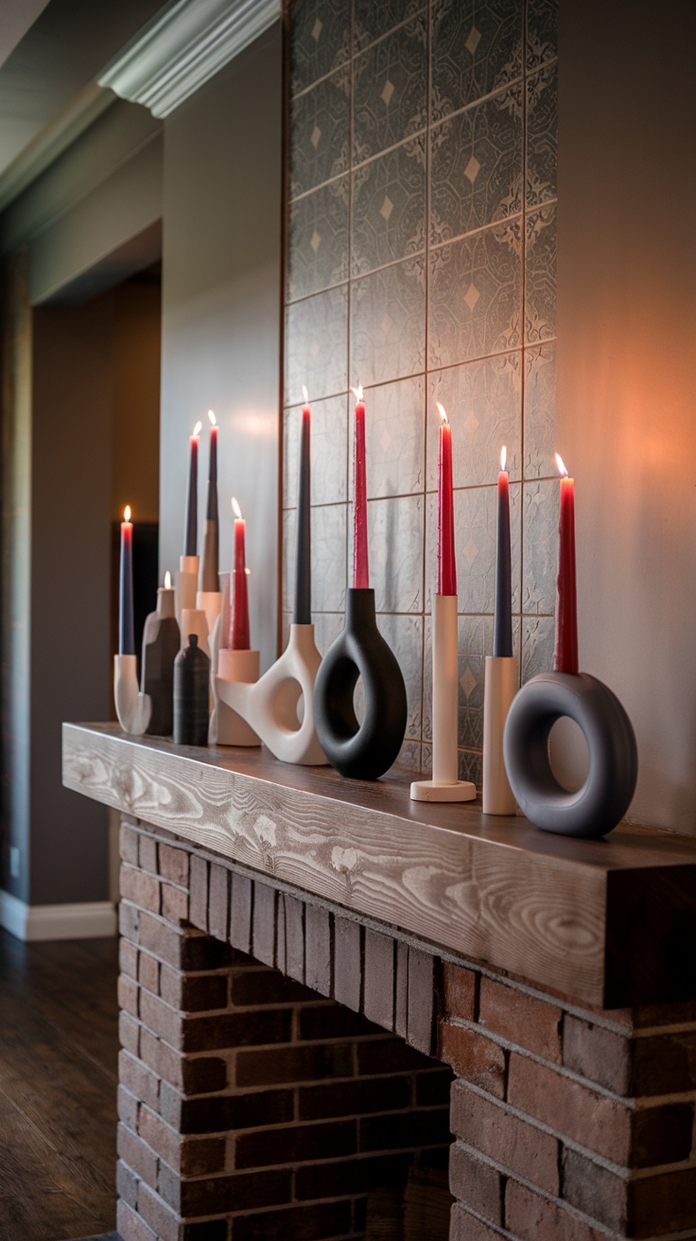 A modern candle display on a mantel featuring various candle holders and colorful candles.