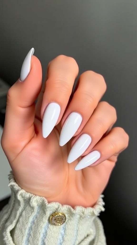 A hand with long white chrome nails, showcasing a sleek and shiny finish.