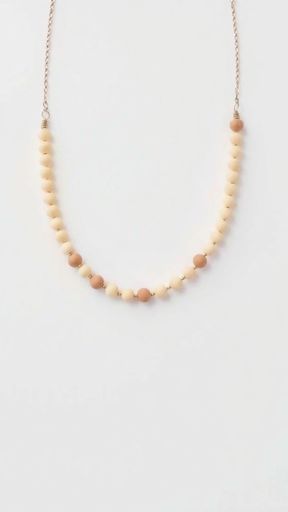 A minimalist beaded necklace with neutral-toned beads on a delicate chain.
