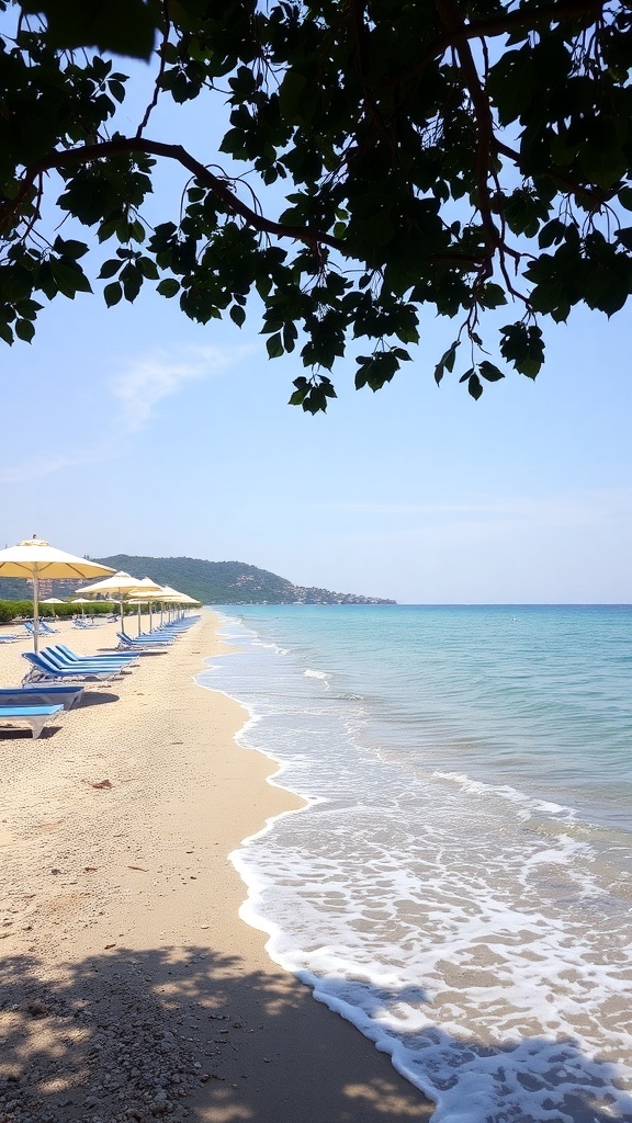 A serene view of Alykanas Beach with sun loungers and umbrellas along the shoreline, clear blue water, and a gentle wave lapping at the sand.