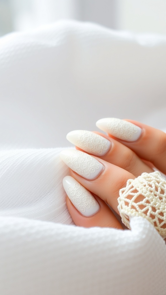 Close-up of textured white almond nails with lace design