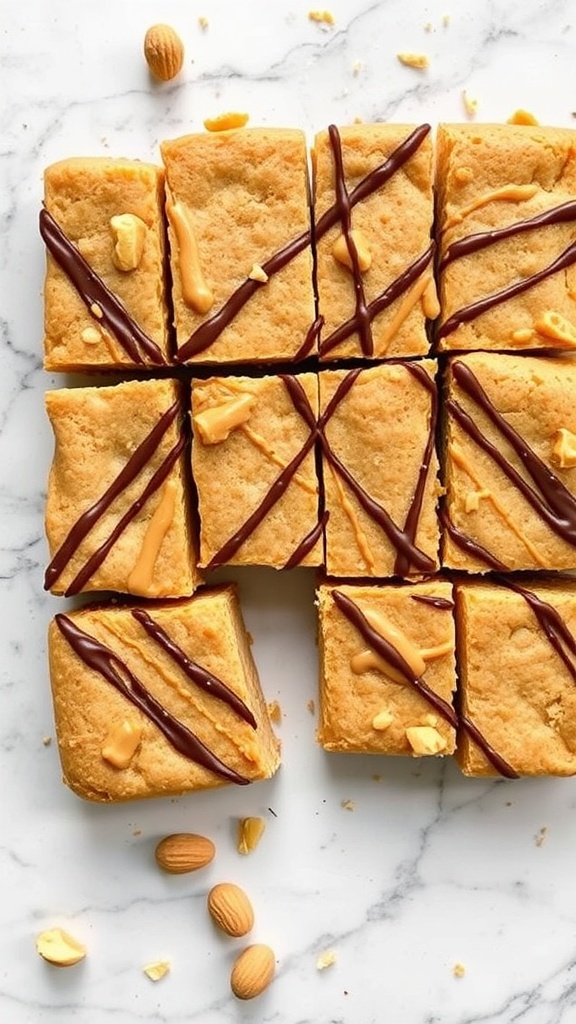 Peanut butter blondies drizzled with chocolate and topped with peanuts, cut into squares on a marble surface.