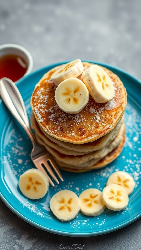 A stack of banana oatmeal pancakes topped with banana slices on a blue plate, with a fork and syrup on the side.