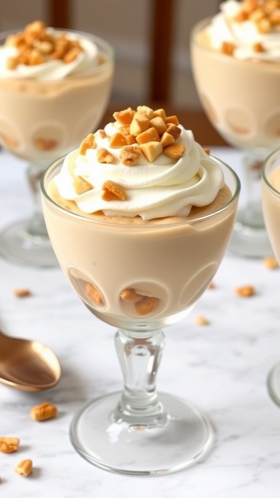 Peanut butter mousse topped with whipped cream and chopped peanuts in a glass dish.