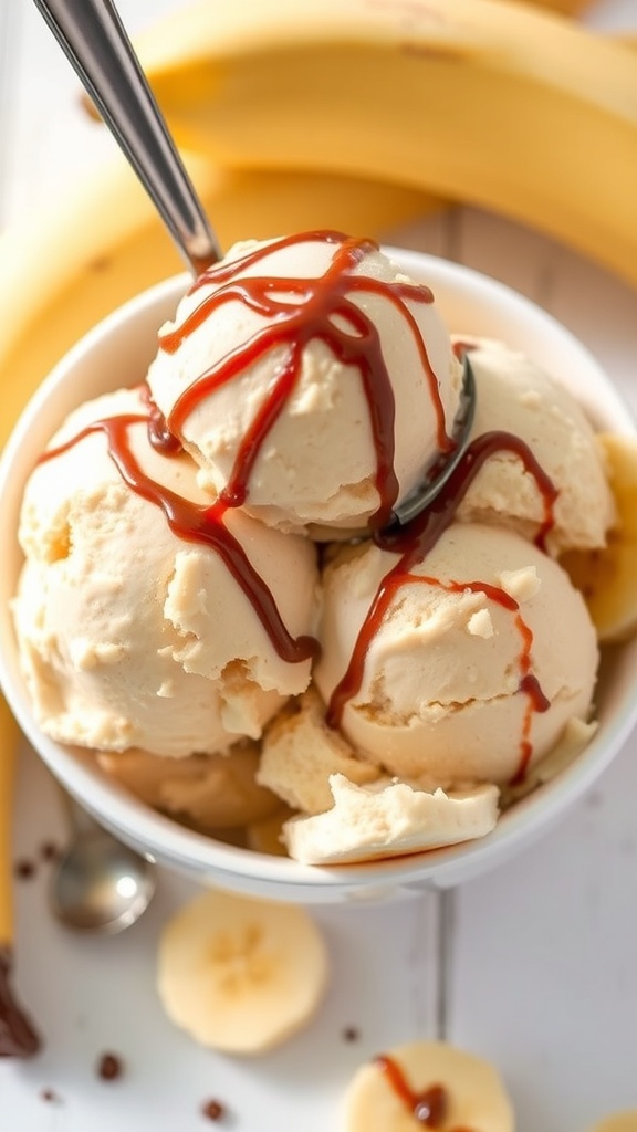 A bowl of peanut butter banana ice cream with drizzled sauce and banana slices in the background.