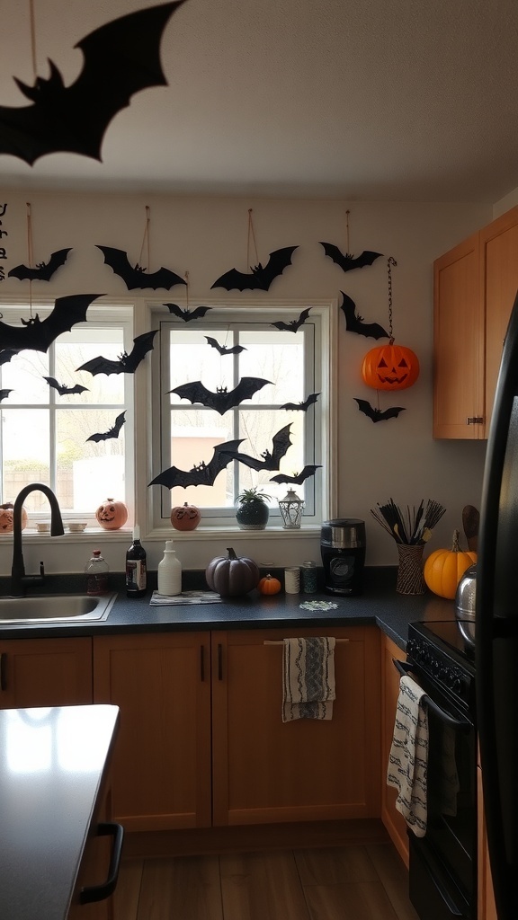 A kitchen decorated for Halloween with bat and moon wall hangings, pumpkins, and a cozy atmosphere.