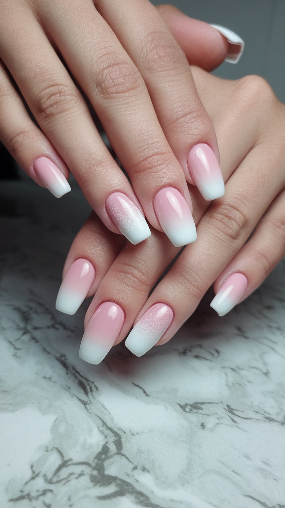 Chic ombre gel nails with a pink and white gradient effect.