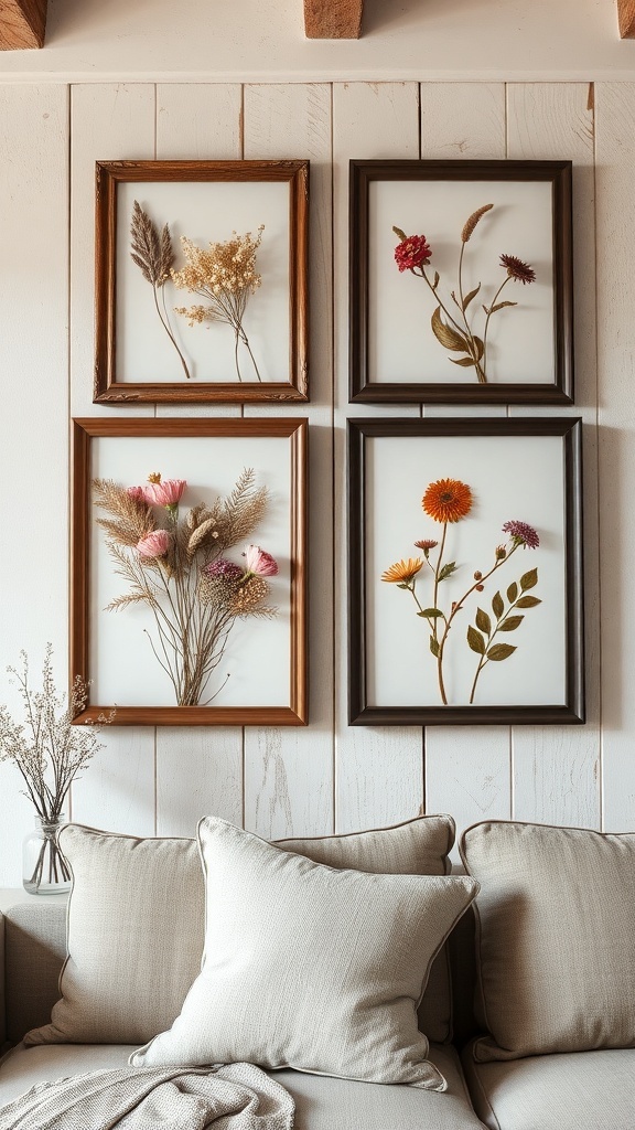 Framed floral arrangements on a wall above a couch