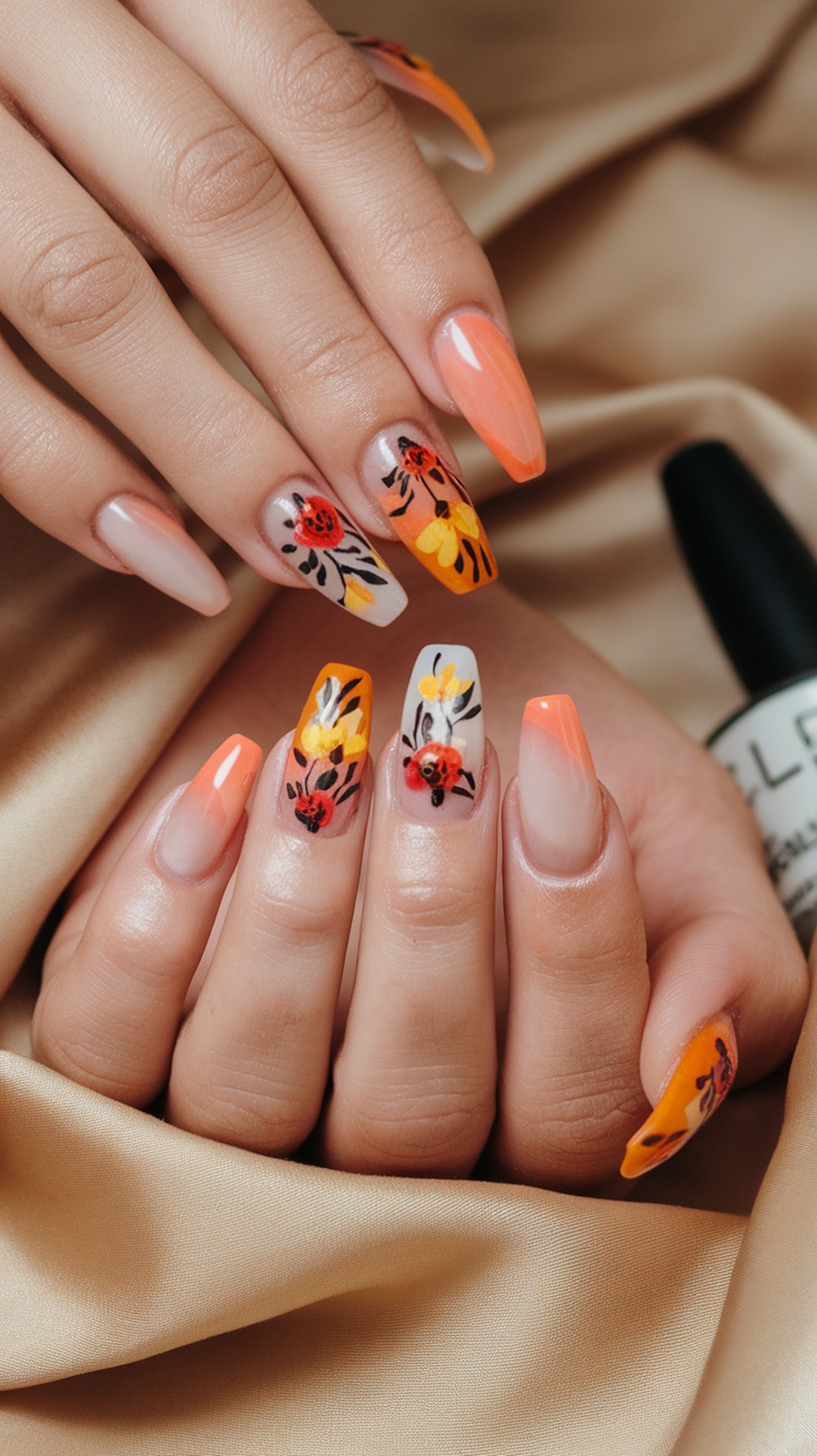 Beautiful autumn-themed floral nail art with vibrant colors.