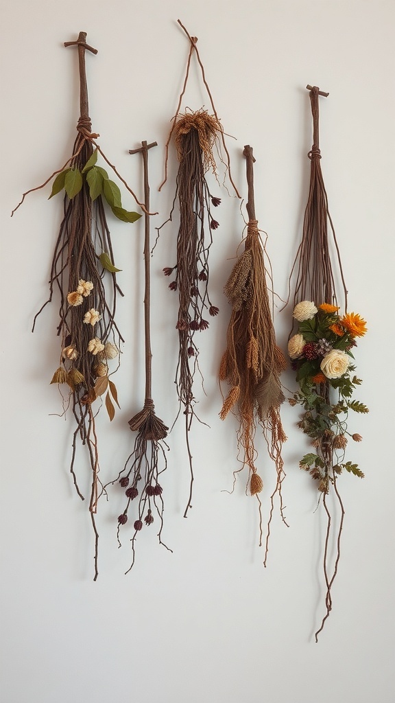 A collection of nature-inspired wall hangings made from dried flowers and branches.