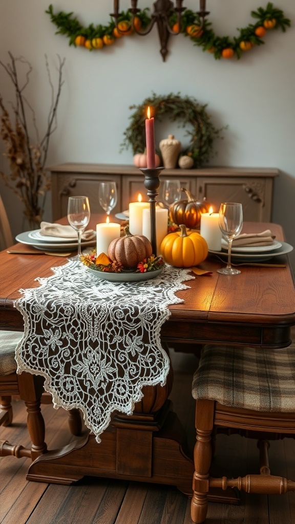A wooden dining table with a vintage lace table runner, pumpkins, candles, and autumn decorations.