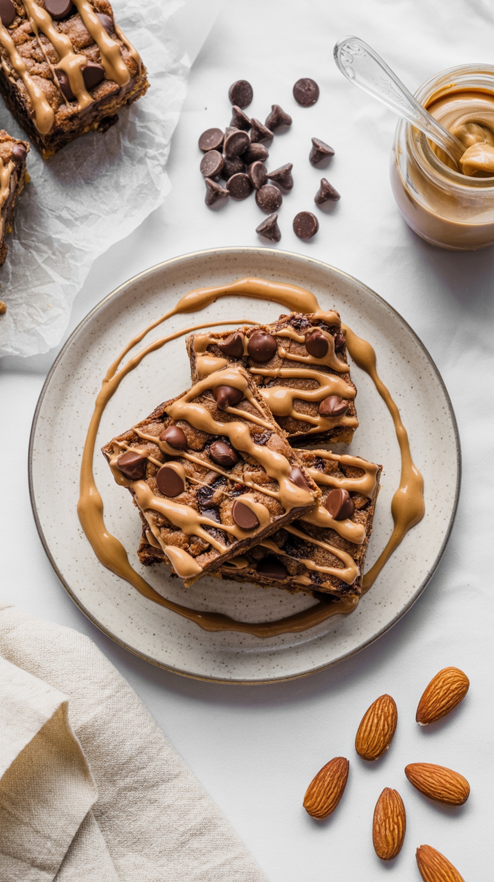 Chocolate chip almond butter bars drizzled with almond butter