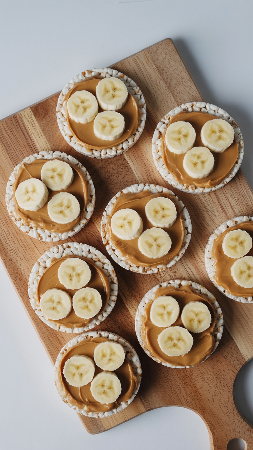 Rice cakes topped with peanut butter and banana slices