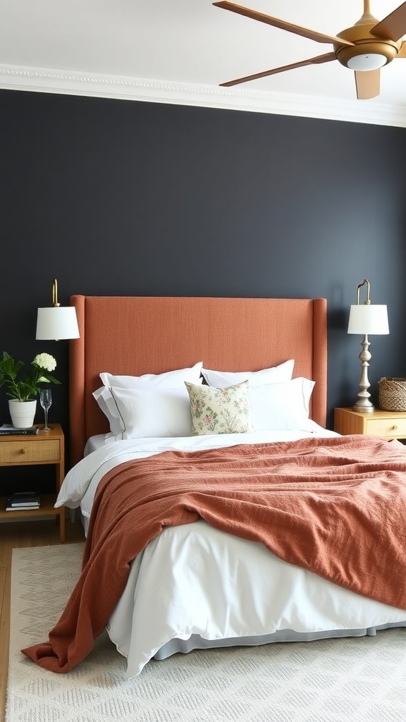 A cozy bedroom featuring a DIY fabric headboard in terracotta, complemented by a dark wall and soft bedding.