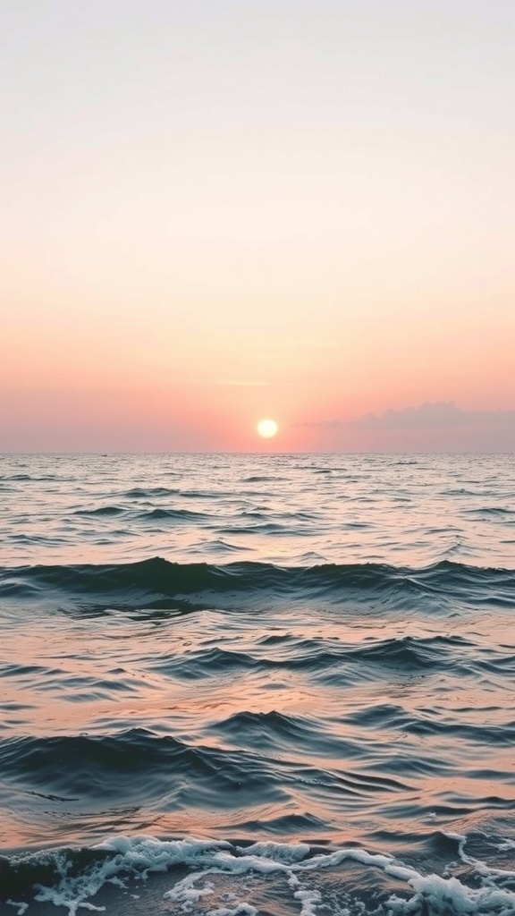 Ocean waves at sunset with a pink and orange sky