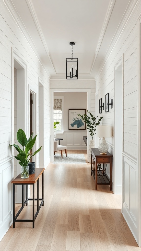 A bright bungalow hallway featuring textured shiplap walls, dark light fixtures, and decorative plants.