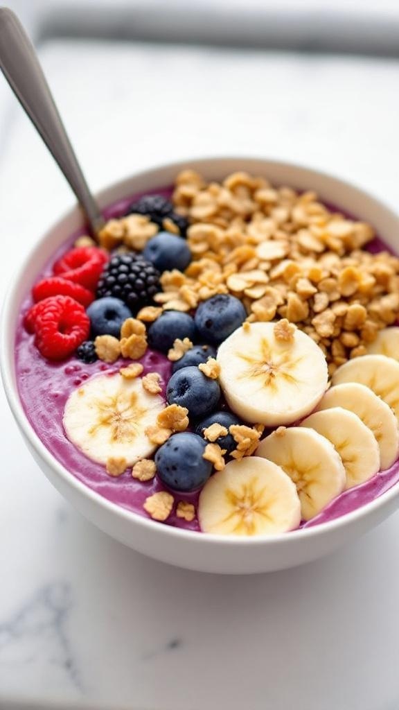 A colorful rainbow smoothie bowl topped with fresh fruits, granola, and edible flowers.
