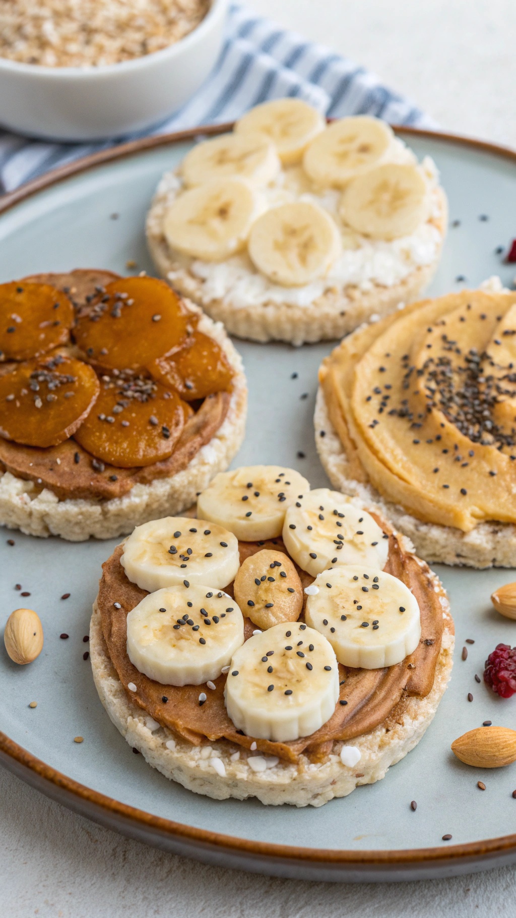 Rice cakes topped with nut butter, banana slices, and chia seeds.