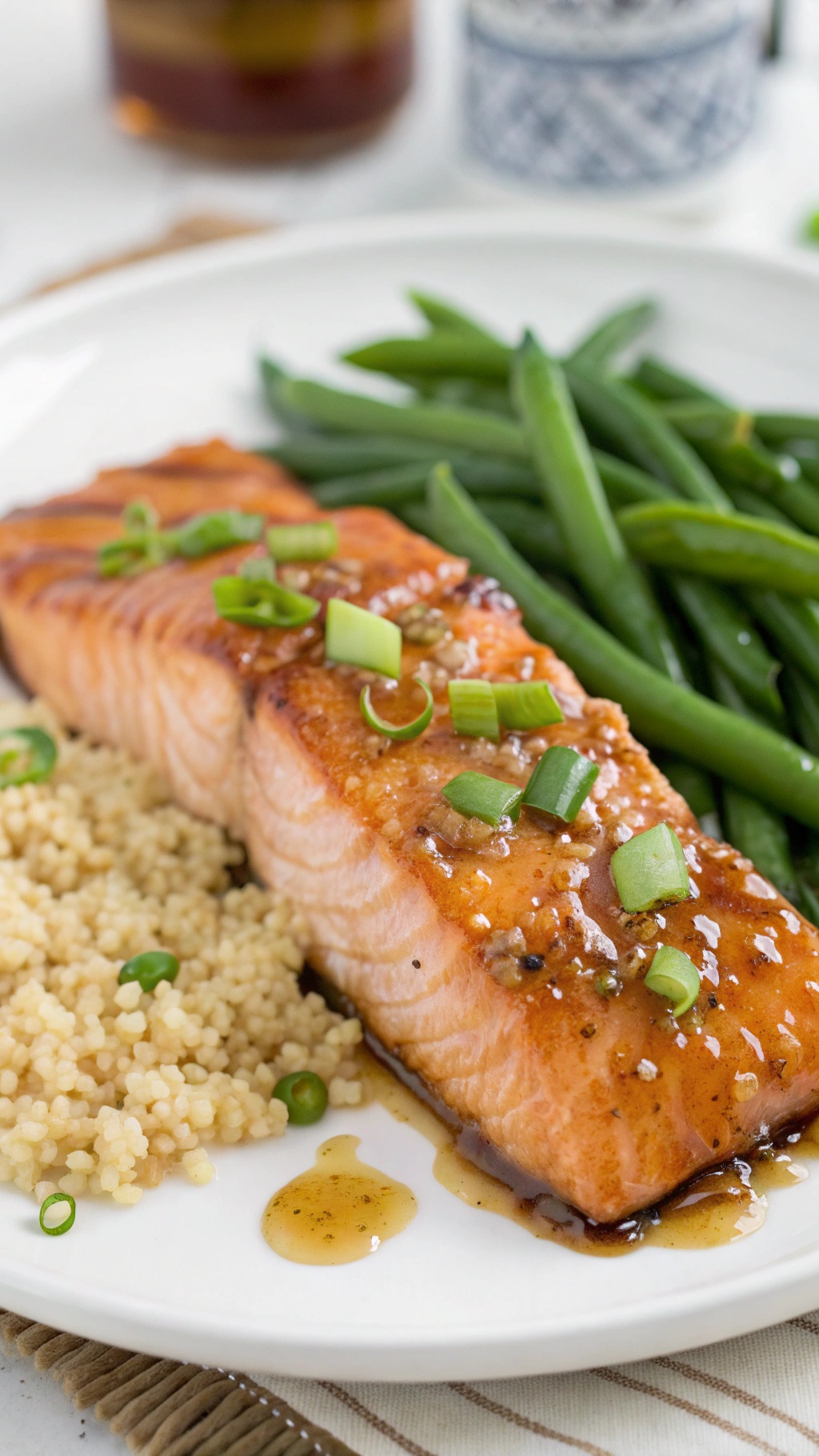 Spicy Honey Garlic Salmon served with couscous and green beans.