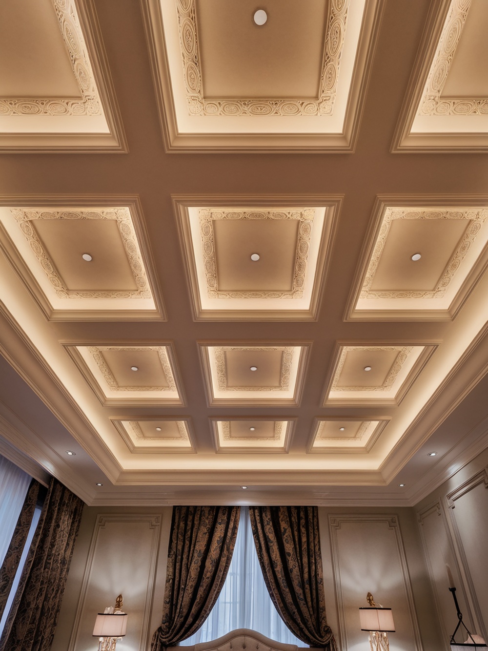 A beautifully designed coffered ceiling with recessed lighting in a bedroom.