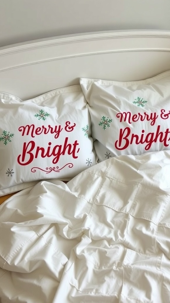 Two white pillowcases with the text 'Merry & Bright' in red, placed on a bed with white bedding.