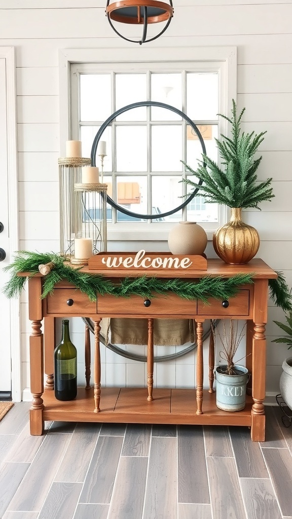 A wooden entryway table decorated with evergreen garlands, candles, and a small tree, featuring a 'welcome' sign.