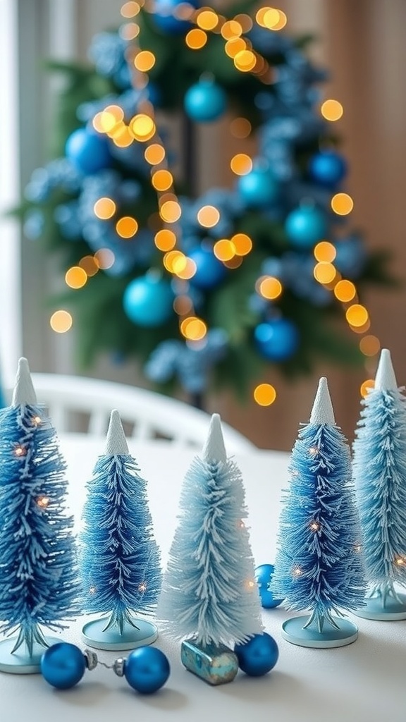 A collection of mini blue accent trees with a wreath in the background, adorned with blue ornaments and fairy lights.