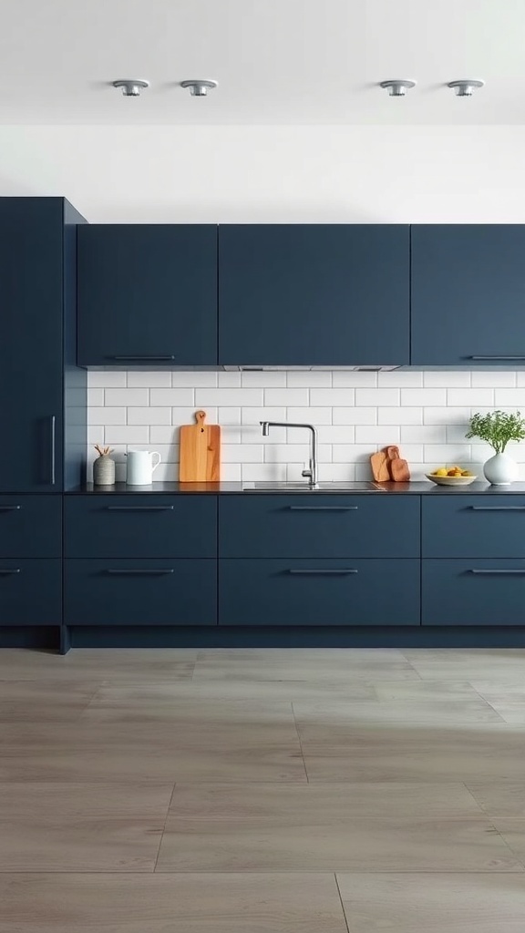 A modern kitchen featuring minimalist dark blue slab cabinets with a light wood floor and white tile backsplash.