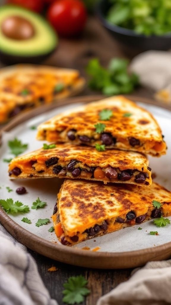 Sweet potato and black bean quesadillas on a plate with fresh cilantro and avocado