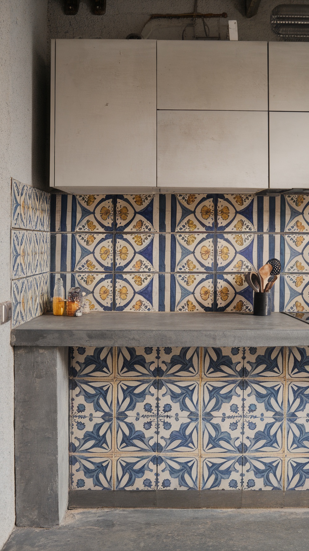 A kitchen backsplash featuring colorful cement tiles with intricate patterns.