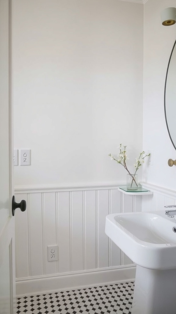 A bathroom featuring textured wall treatments with wainscoting and patterned floor tiles.